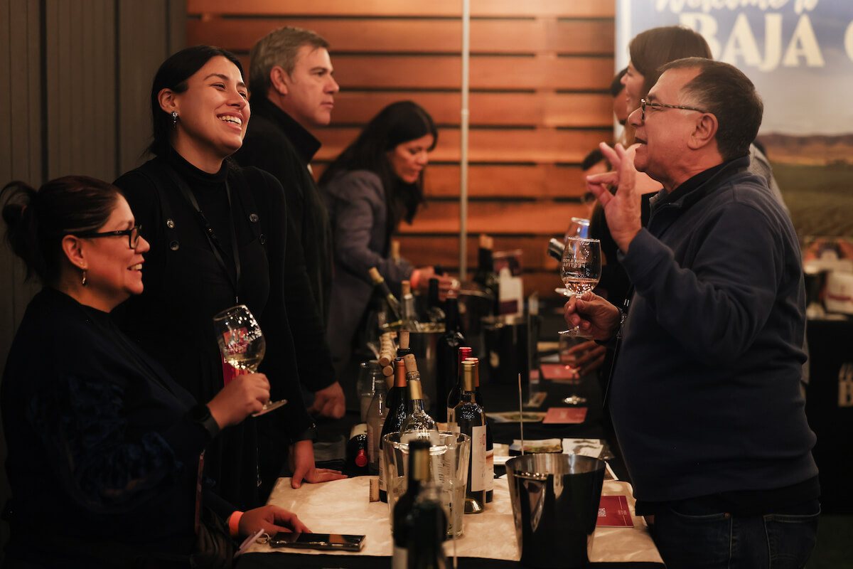 Guests tasting with a producer on opening night