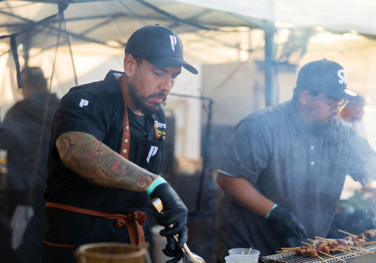 Pechanga chefs grill skewers over an open flame
