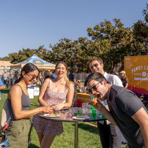 Attendees eating tacos at San Diego Bay Wine & Food Festival Grand Fiesta