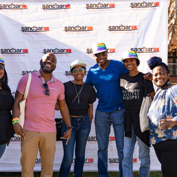 Attendees posing for a photo at San Diego Bay Wine & Food Festival Grand Fiesta