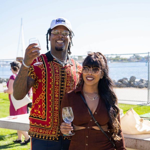 Man and woman holding wine glasses at San Diego Bay Wine & Food Festival Grand Tasting