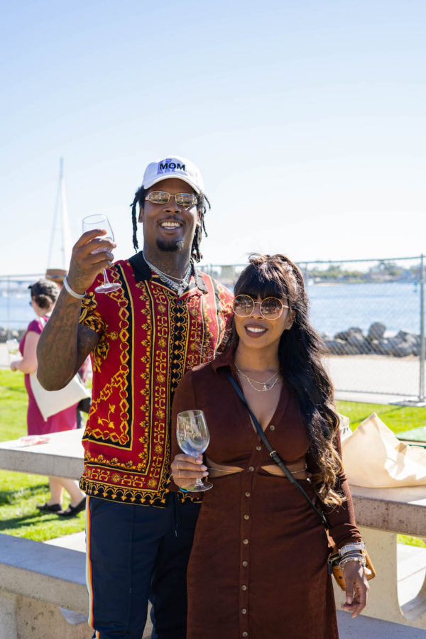 Man and woman holding wine glasses at San Diego Bay Wine & Food Festival Grand Tasting