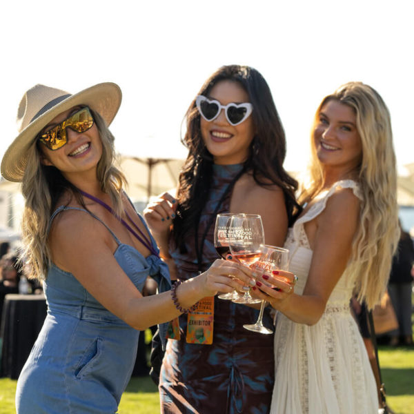Women posing for a photo at San Diego Bay Wine & Food Festival Grand Tasting