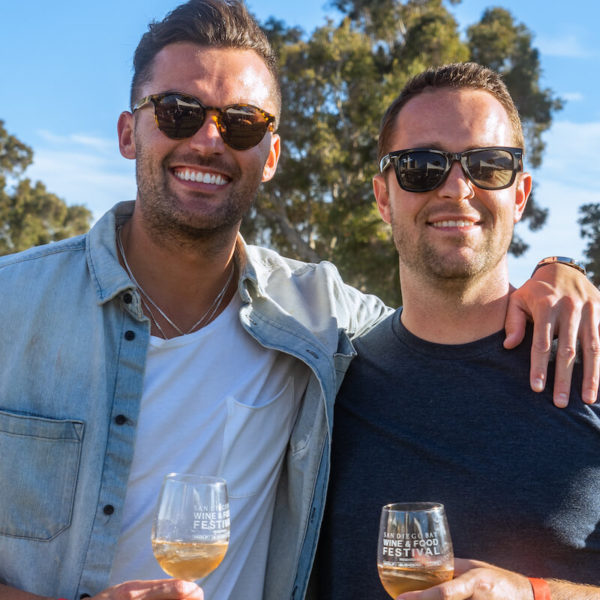 Attendees posing for a photo at San Diego Bay Wine & Food Festival Grand Tasting