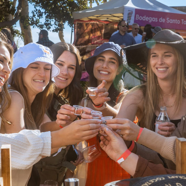 Attendees drinking alcohol at the San Diego Bay Wine & Food Festival Grand Tasting