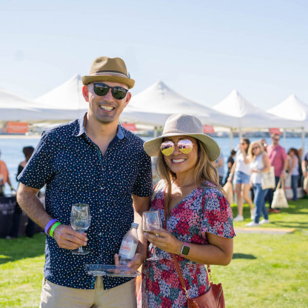 Attendees posing for a photo at the San Diego Bay Wine & Food Festival Grand Tasting
